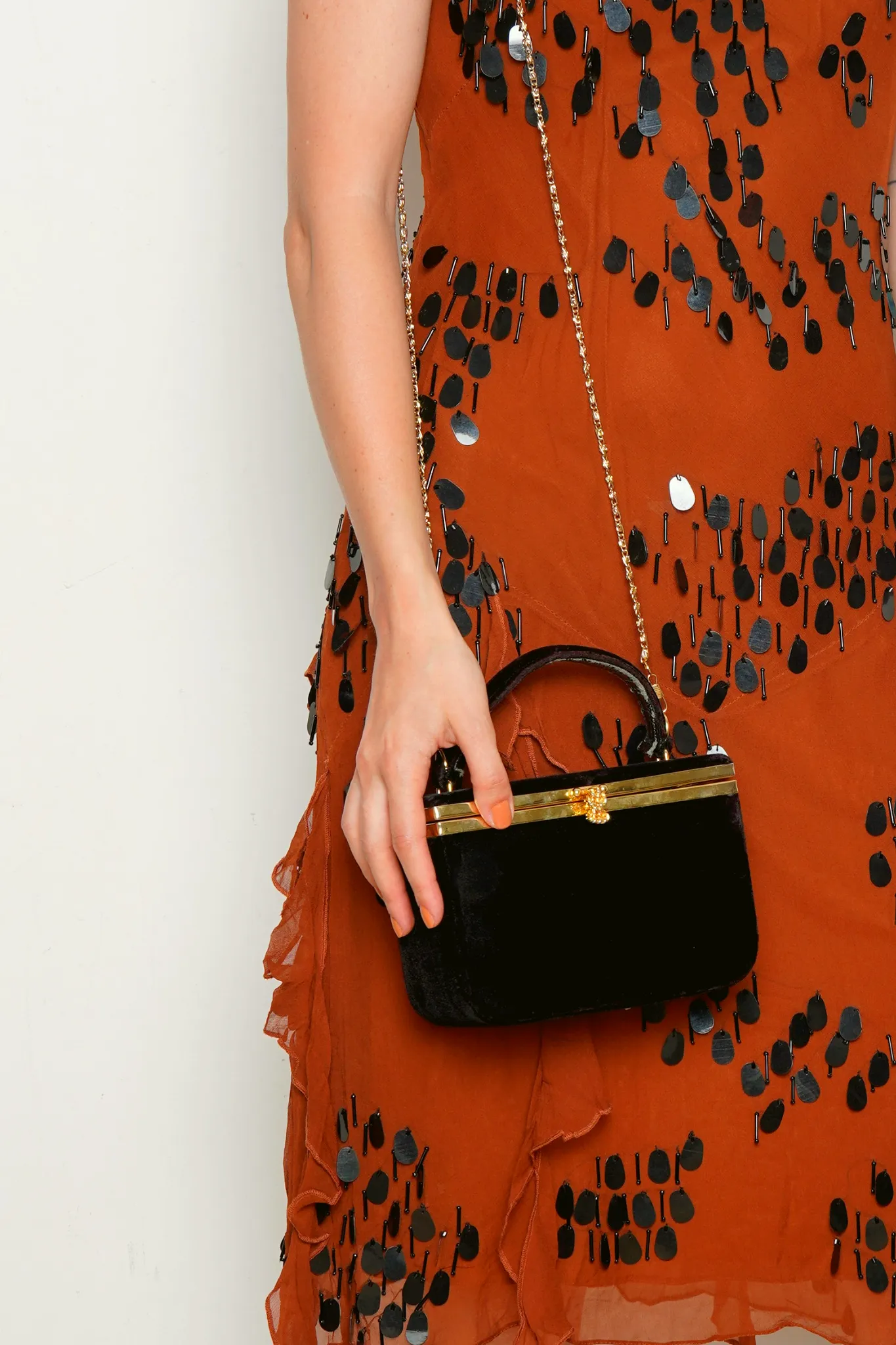 Black Velvet bag with gold metal clasp and shoulder chain.